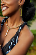 model wearing rectangular bar earrings and a bar pendant choker