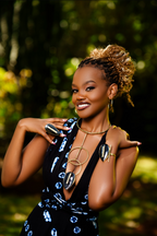 Model wearing an almond shaped black cow horn statement gold ring, matching cuff bracelet and matching neckpiece