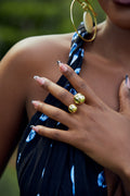 Close-up of a model wearing a gold double orb design ring 
