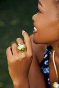 Model wearing a gold spherical dome hammered ring 